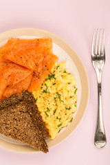 Smoked Salmon and Scrambled Eggs With Rye Bread and Lemon Breakfast