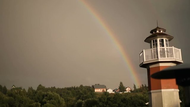 Lighthouse in the summer on rainbow background. Moscow
