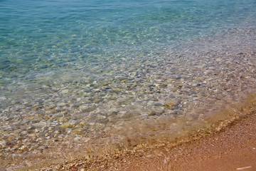 Seawater with a stones and sand