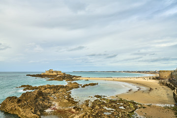 Saint Malo beach, Fort National and rocks during Low Tide. Brittany, France, Europe. 