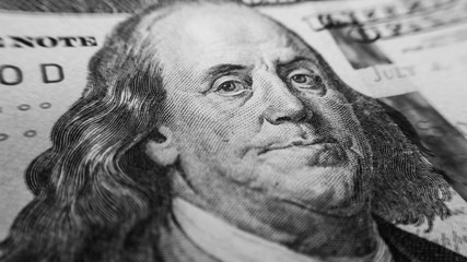 Black and white portrait of Benjamin Franklin on one hundred dollar bill