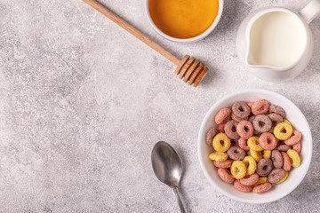 Colorful cereal rings in bowl.