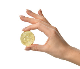 Fototapeta premium Hand hold gold bitcoin cryptocurrency on grey background