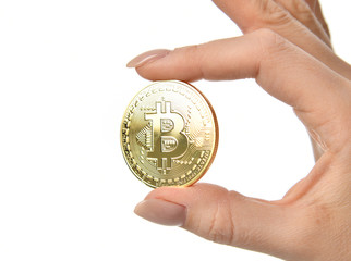 Hand hold gold bitcoin cryptocurrency isolated on white background