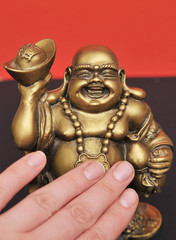 Golden Buddha on a black background 
