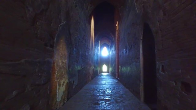 Bagan Temple. Walking  along narow coridor inside the Dhammayangyi temple in Bagan, Myanmar.
