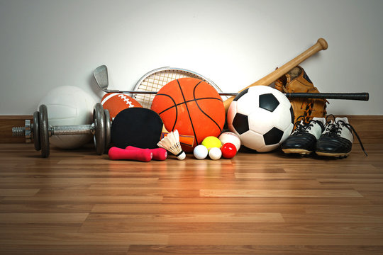 Sports Equipment On Wooden Background