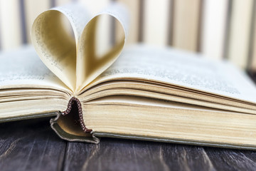 Stacks of colored books on a wooden table. concept of reading habits