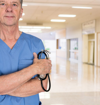 Senior Medical Consultant In Blue Scrubs