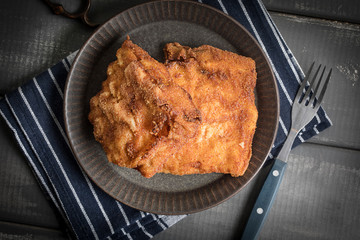 Two fried cod fillet pieces.