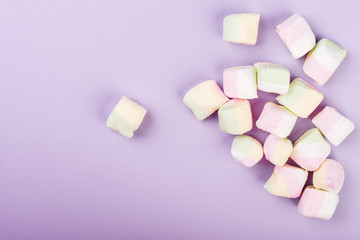 Marshmallows on pink background, top view.