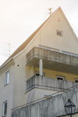 Fototapeta premium broken electric wires hanging on the house