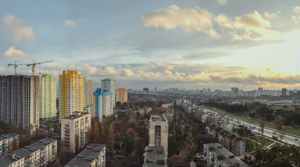 Fototapeta na wymiar cityscape of Kiev with new and old buildings in spring. Mobile photo