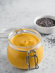 Vegan creamy cheddar cheese sauce with chia seeds
