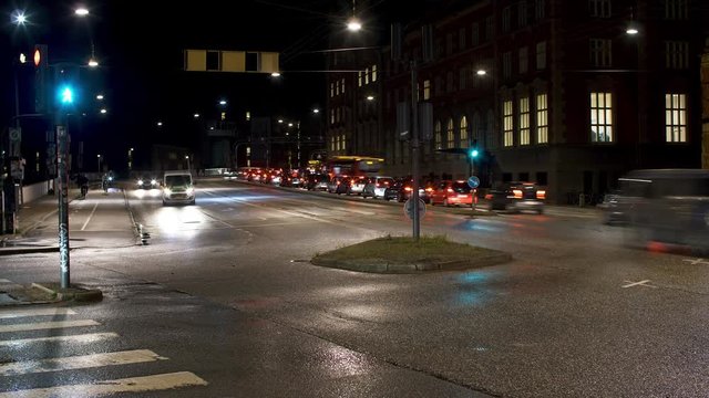 Cars and bikes in Copenhagen at night after rain. Filmed outside the parlement "Christiansborg" with long exsposure