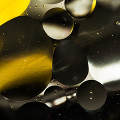 water and oil, beautiful color abstract background based on white yellow and gray circles and ovals, macro abstraction