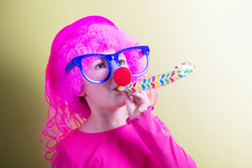 little girl wearing carnival mask
