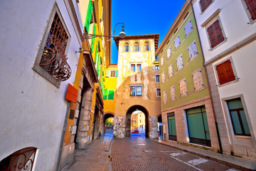 Town gate and colorful architecture of Udine