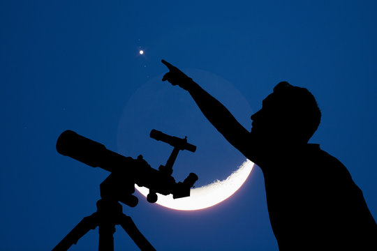 Silhouette of a man with telescope, Moon and stars. 