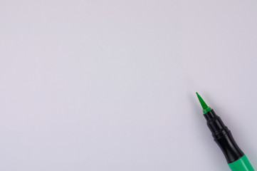Fototapeta premium Single new smooth green marker brush on white background with copy space