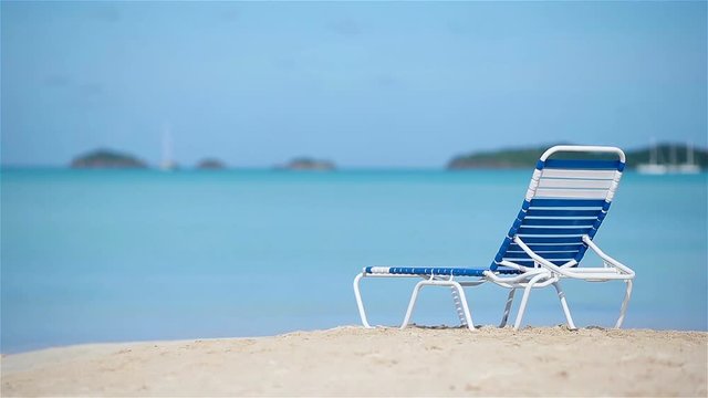 One sunbed on white tropical caribbean beach