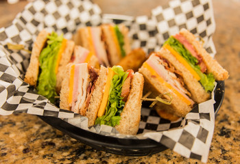 Club Sandwich In Basket On Granite Table