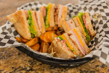 Club Sandwich In Basket On Granite Table