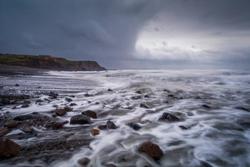 Sandymouth bay cornwall england uk at dusk on the coast path 
