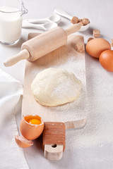 Dough preparation recipe for bread, pizza, pasta, cookies or pie ingridients, food flat lay on kitchen table background. Working with butter, milk, yeast, flour, eggs, sugar pastry or bakery cooking.