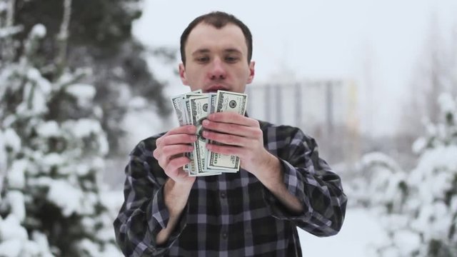 a man with dolor bills in his hands