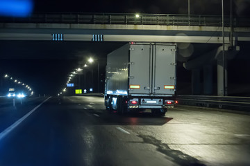Trucks move on a night