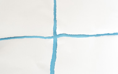 ripped paper isolated on blue background with copy space for text