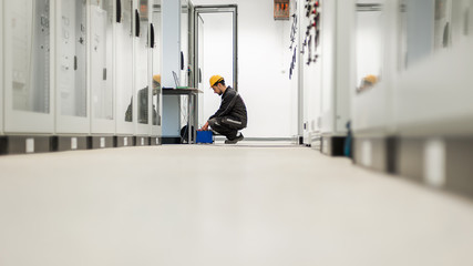 Maintenance engineer inspect system with relay test set equipment