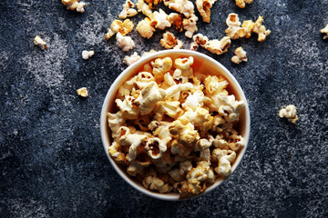 Obraz na płótnie Canvas Cinema concept with popcorn in red white bag