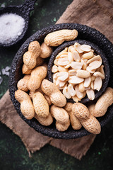 Raw peeled peanuts on bowl