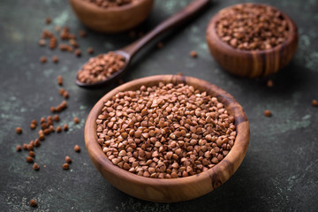 Buckwheat groats in wooden bowl