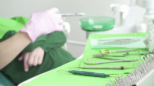 Close-Up Of Dentist Using Dental And Surgical Instruments