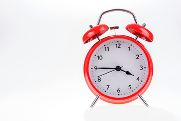 Fototapeta na wymiar Old red retro alarm clock isolated on white, Time concept