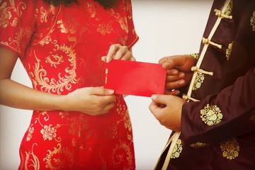Givng present on chinese new year called Ang Pao in red packet