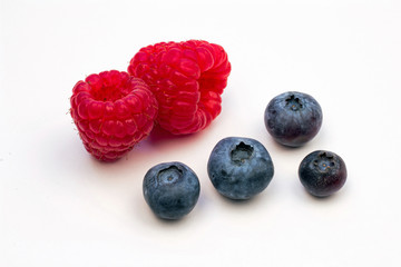 Two Red Raspberries and Four Blueberries
