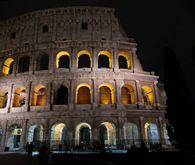 Fototapeta na wymiar Ancient amphitheater Colosseum in the night