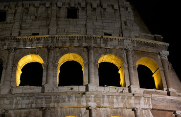 Fragment of ancient amphitheater Colosseum in the night