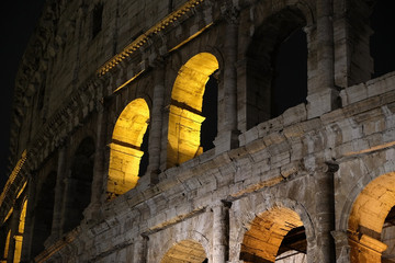 Fragment of ancient amphitheater Colosseum in the night