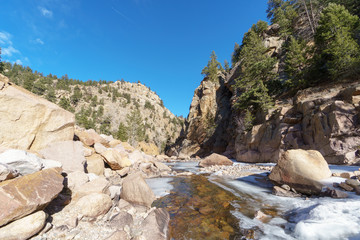 A half frozen stream in the Rocky Mountains of Colorado