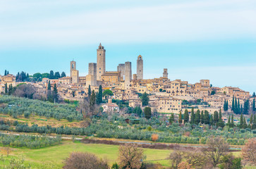 Fototapeta na wymiar San Gimignano (Italy) - The famous small walled medieval hill town in the province of Siena, Tuscany. Known as the Town of Fine Towers, or the Medieval Manhattan. Here the awesome historic center.