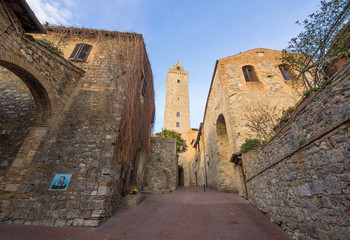 Fototapeta premium San Gimignano (Italy) - The famous small walled medieval hill town in the province of Siena, Tuscany. Known as the Town of Fine Towers, or the Medieval Manhattan. Here the awesome historic center.