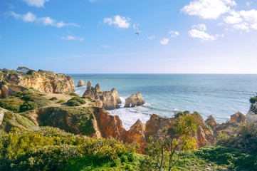 Fototapeta na wymiar Landscape of the rocks, cliffs and ocean beach coastline Algarve Portugal, Europe. Sunny day, 2018. Panoramic nature beauty seascape, sunshine view