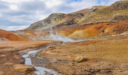 Fototapeta na wymiar Geothermal Area with Stream and Steam