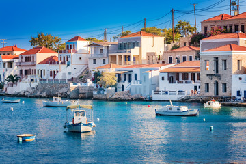Fototapeta na wymiar Boats in port of town Emporio (Nimborio) - capital of island of Halki (GREECE)