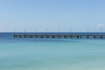 Fototapeta premium Empty Pier in the Calm Blue Sea